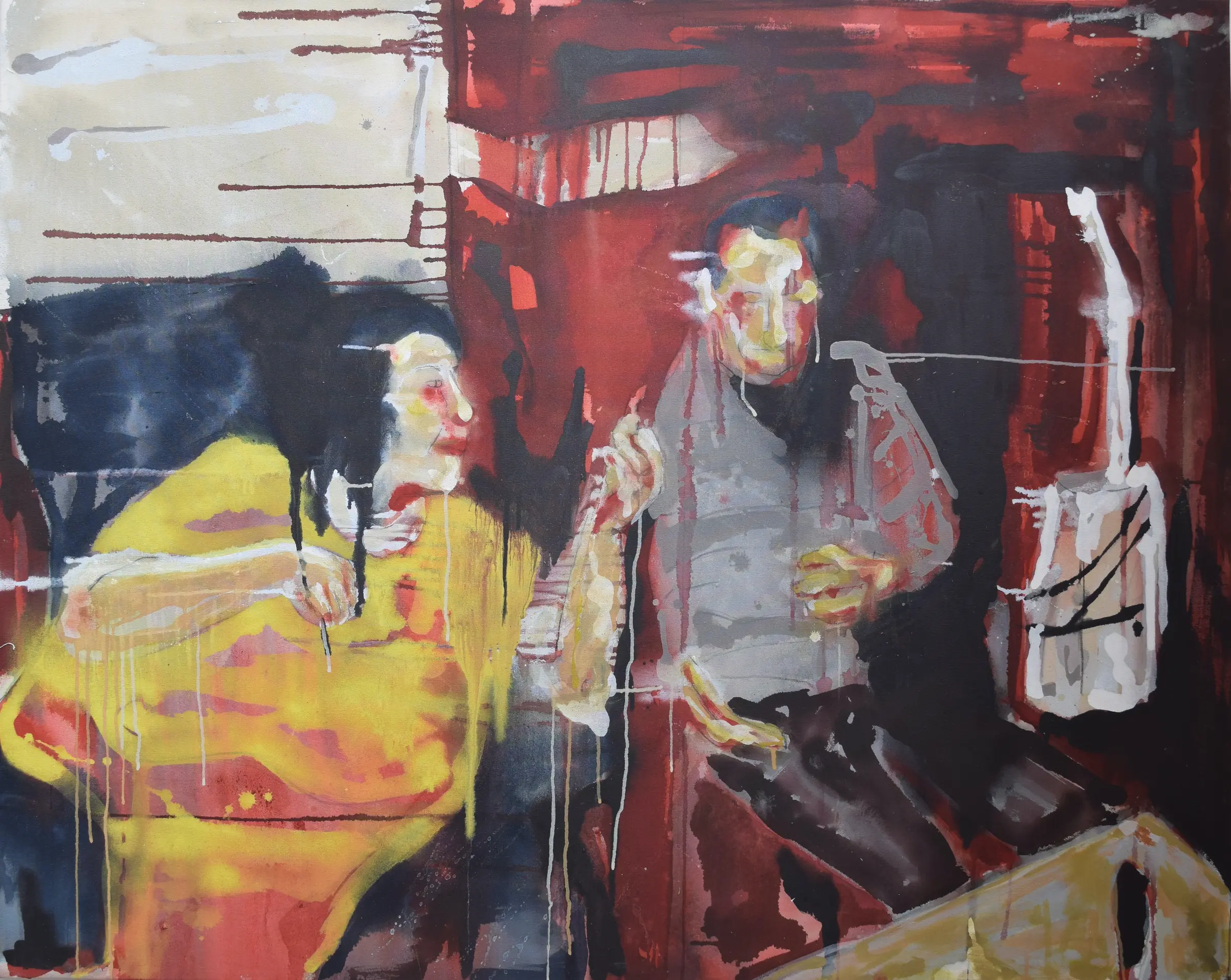 Two figures, seated